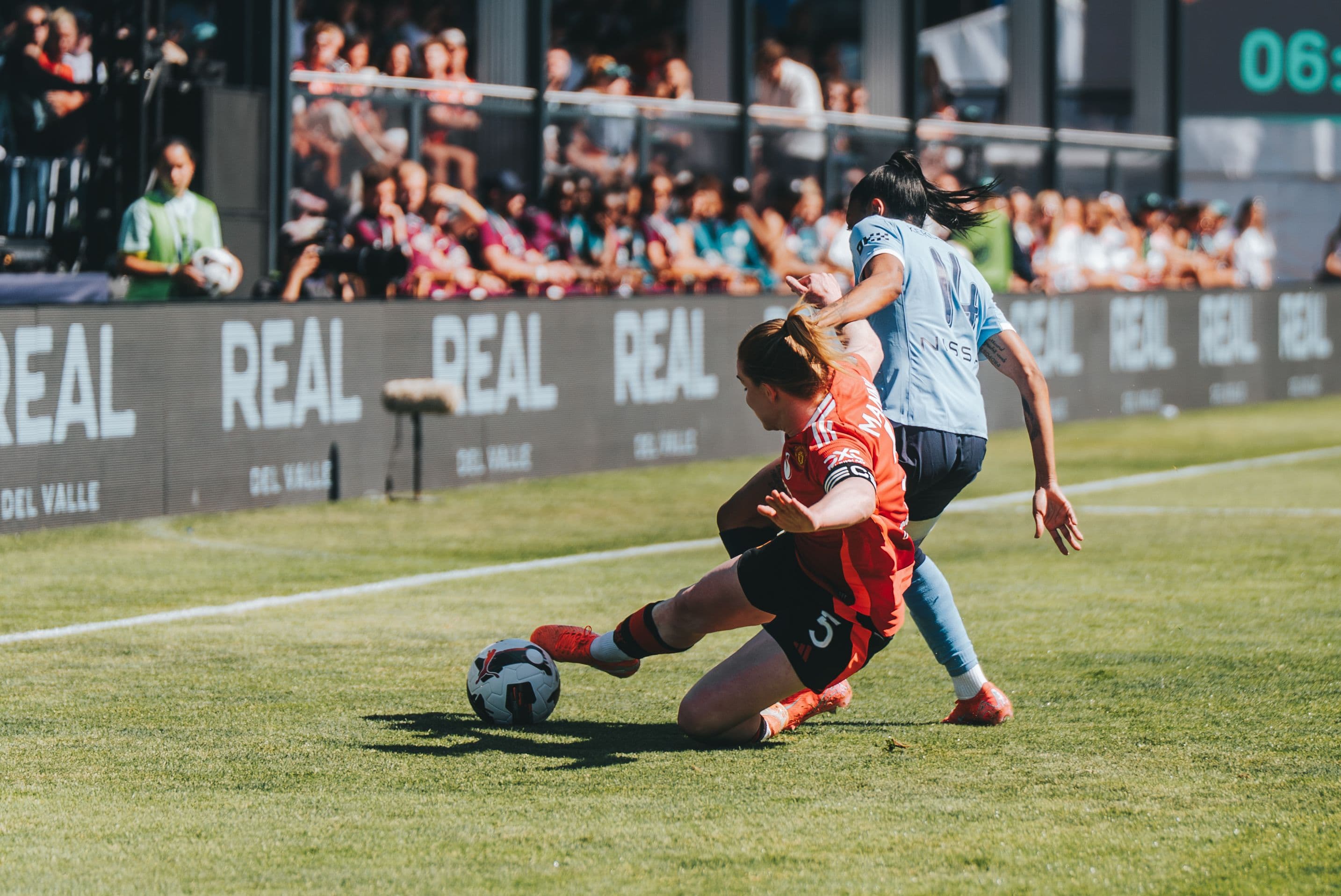 Football player slide tackle at work sevens football tournament